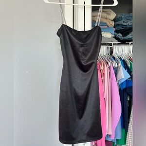 This is a super pretty black dress with silver sparkly straps.